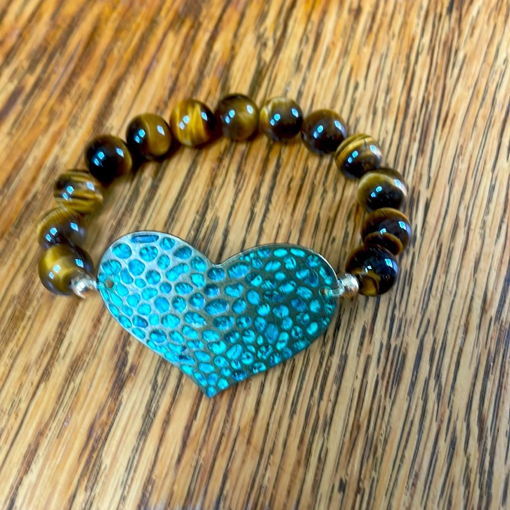 Hand made hammered copper bracelet with tiger eye beads.